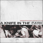 A Knife In The Dark - Somewhere Between The Pew And Fire [7"]